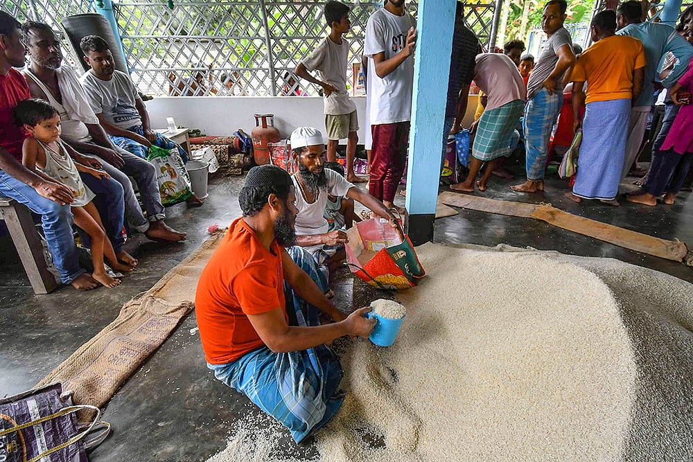 | Photo: PTI : Food items being distributed in Assam